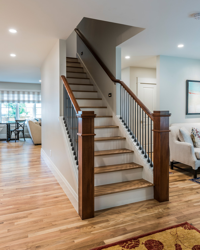 Mid-sized wooden straight mixed material railing staircase photo in Denver with wooden risers