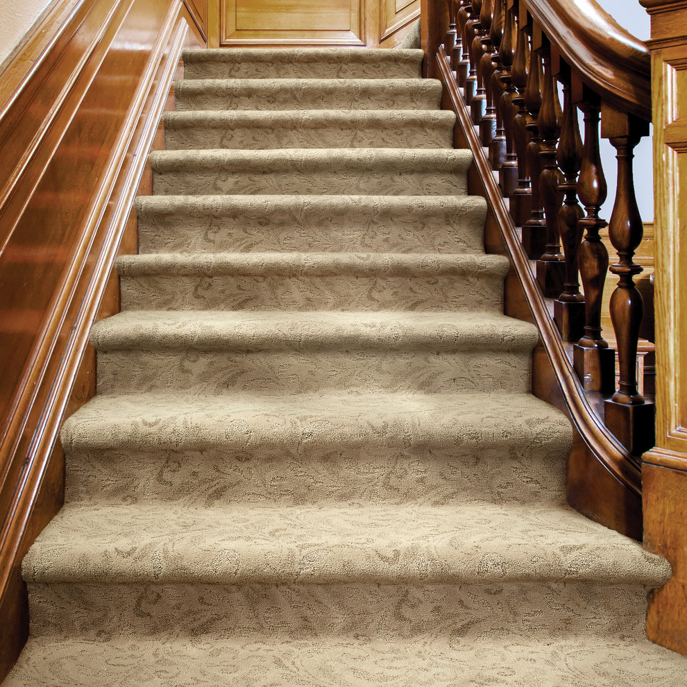 Inspiration for a mid-sized transitional carpeted straight staircase remodel in Boise with carpeted risers