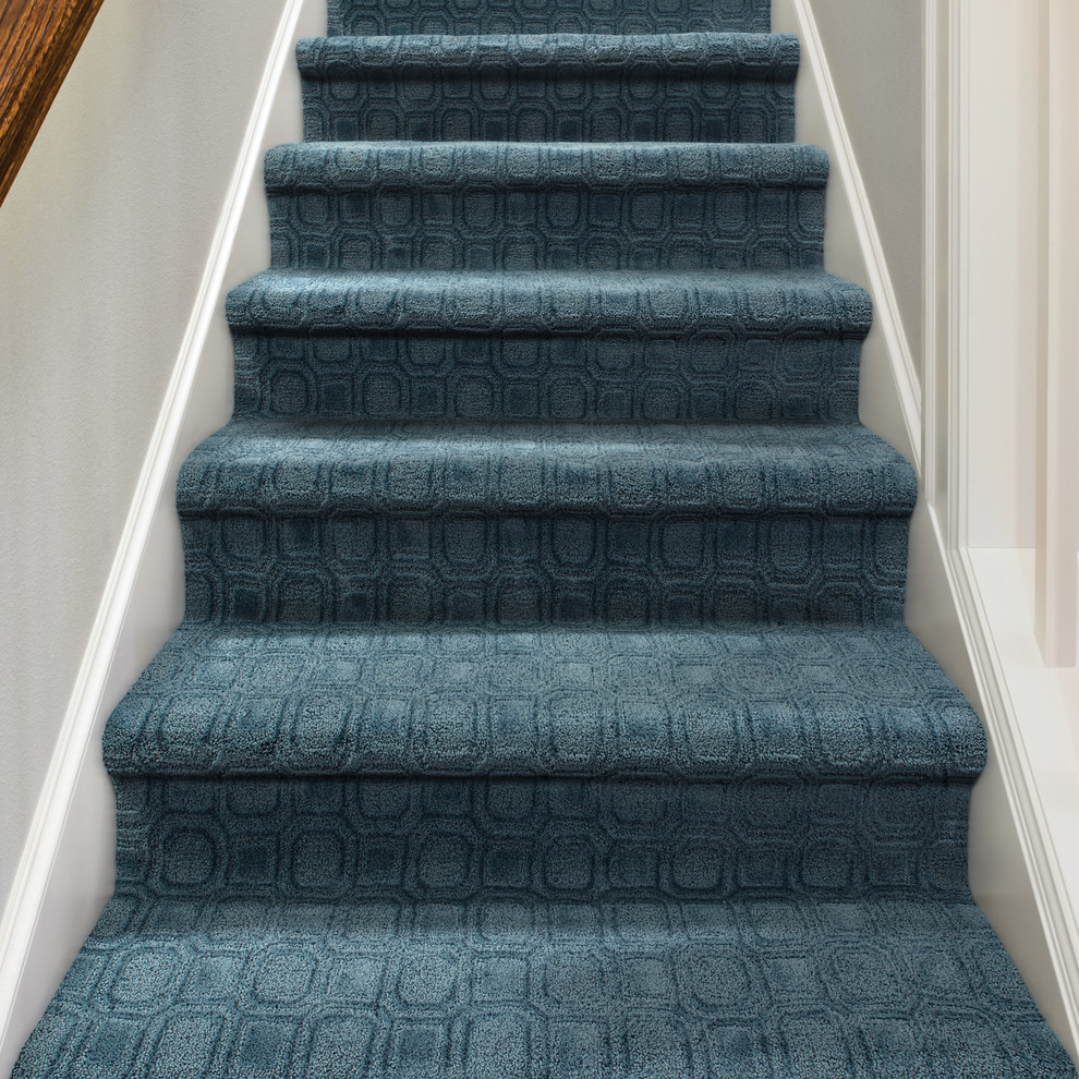 This is an example of a medium sized classic carpeted straight staircase in Boise with carpeted risers.
