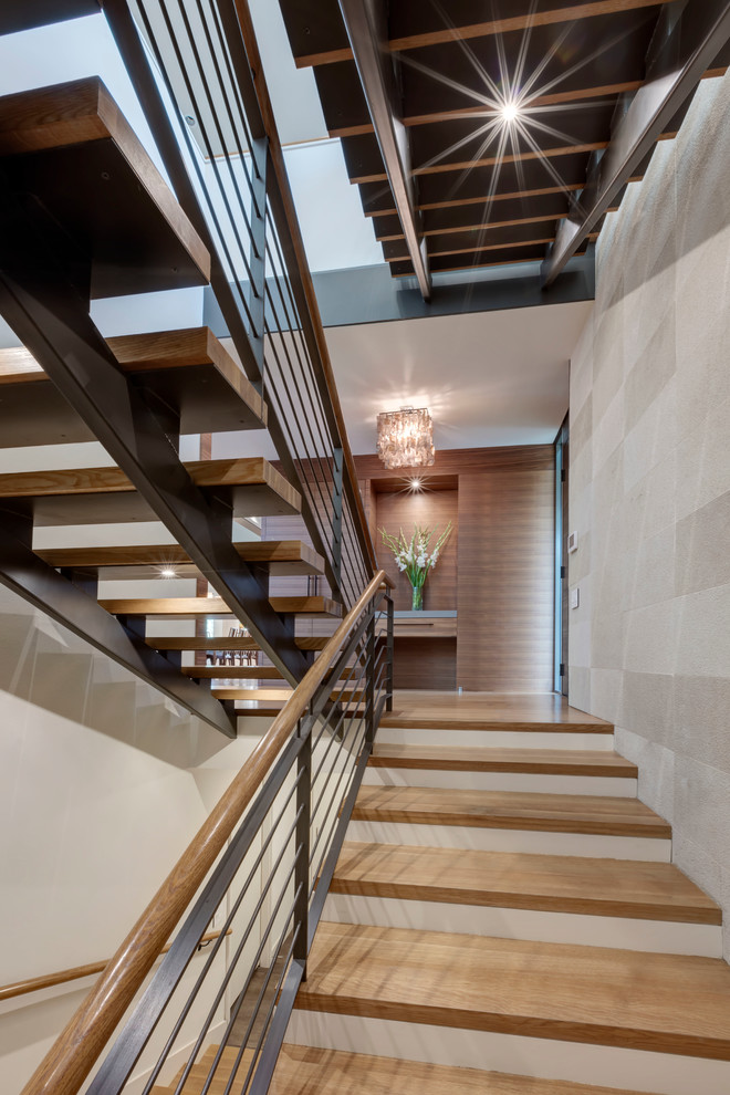 Staircase - large contemporary wooden floating staircase idea in Dallas with metal risers