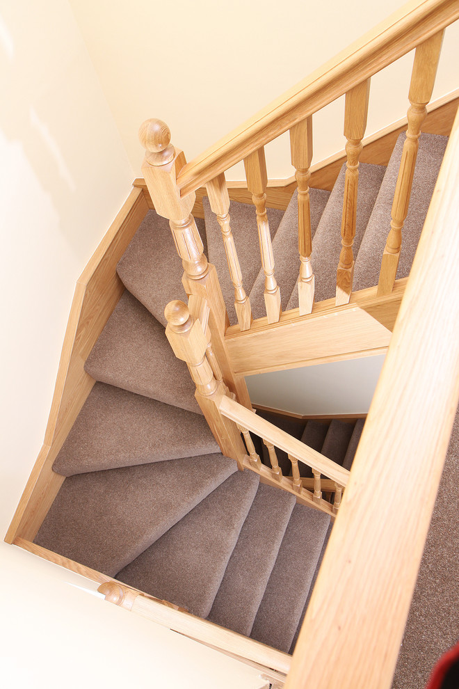 Inspiration for a classic carpeted u-shaped wood railing staircase in Cheshire with carpeted risers.