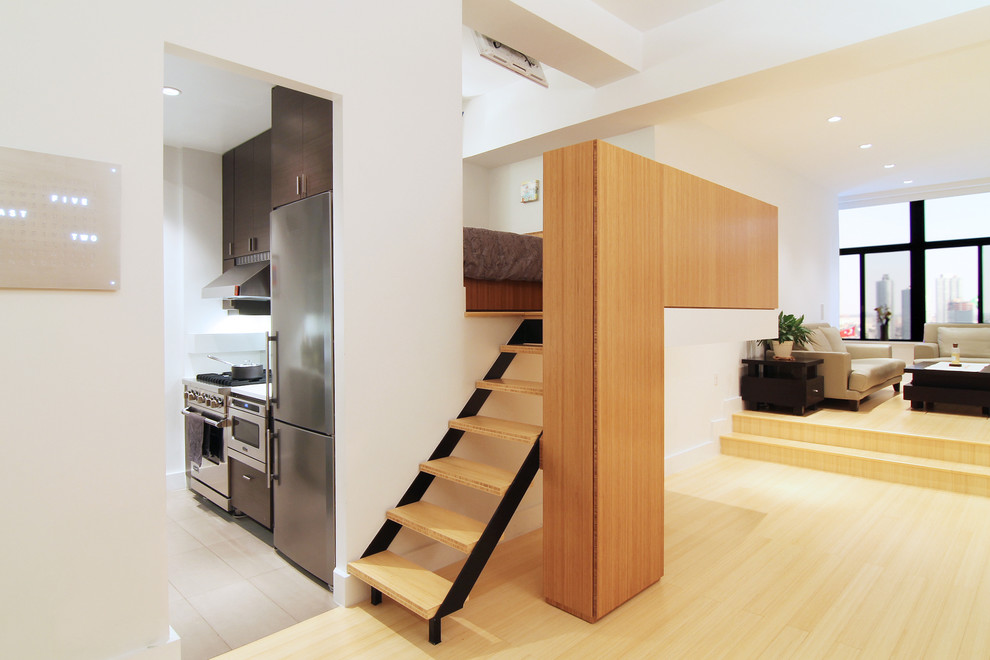 Small modern wood straight staircase in New York with open risers.