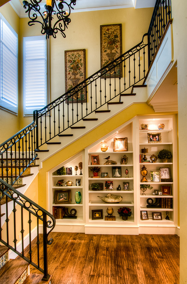 Inspiration for a large mediterranean wood u-shaped staircase in Dallas with tiled risers.