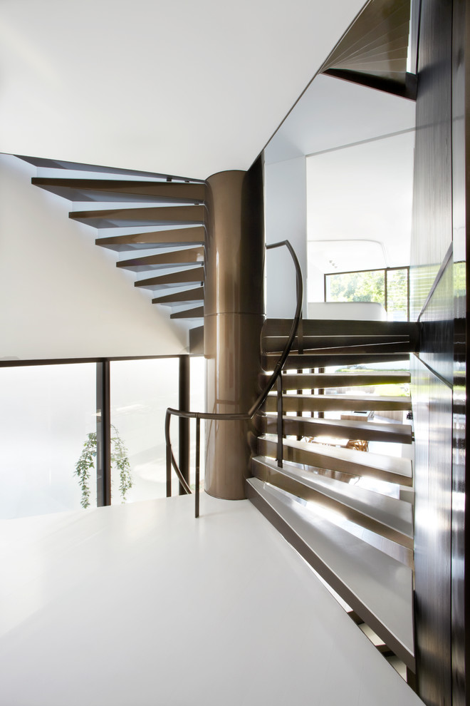 Contemporary spiral staircase in Sydney with open risers.