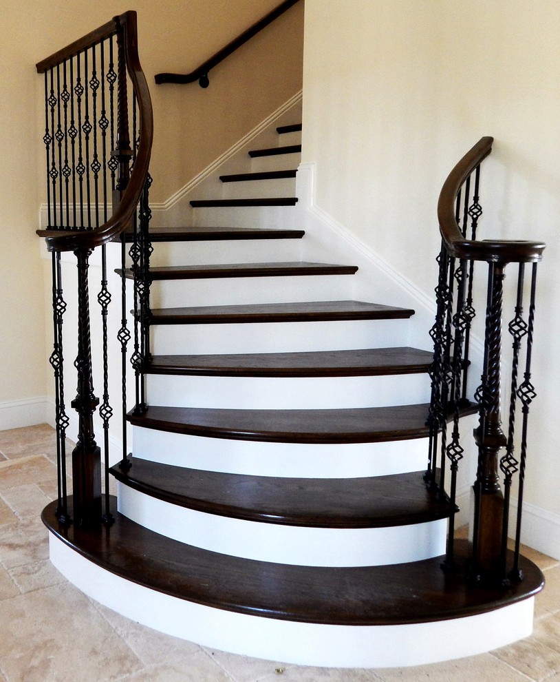 Inspiration for a mid-sized mediterranean wooden l-shaped wood railing staircase remodel in Other with painted risers