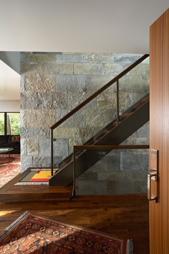 Example of a minimalist wooden floating open staircase design in Minneapolis
