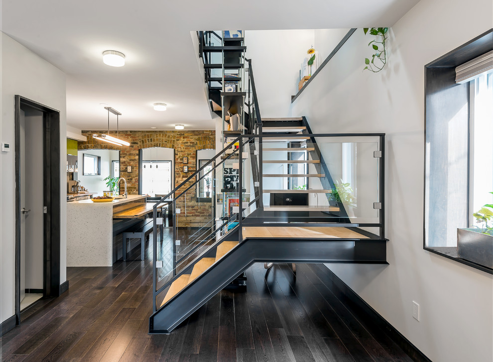 Modern wood u-shaped staircase in Toronto with open risers.