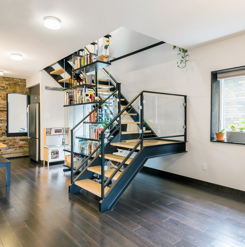 Contemporary wood u-shaped staircase in Toronto with open risers.