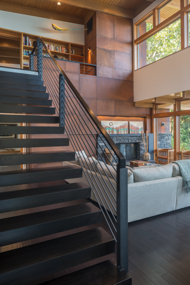 Idée de décoration pour un escalier flottant minimaliste de taille moyenne avec un garde-corps en matériaux mixtes.