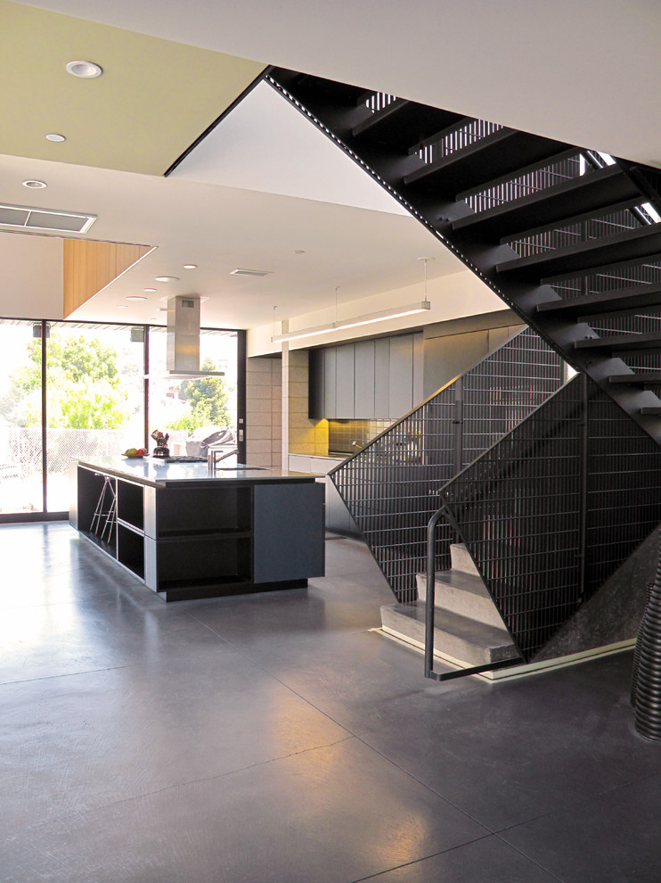 Example of a large trendy concrete u-shaped staircase design in San Francisco with concrete risers