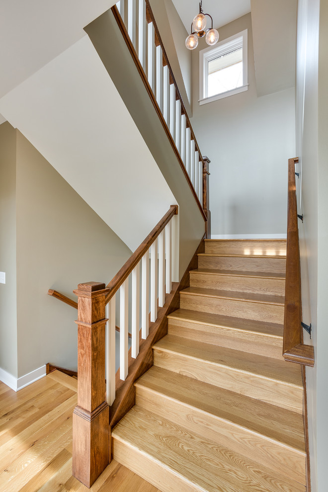 Staircase - mid-sized craftsman wooden u-shaped staircase idea in Minneapolis with wooden risers
