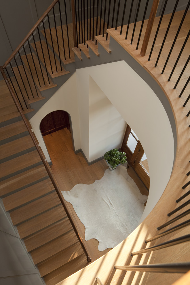 Elegant wooden staircase photo in Austin