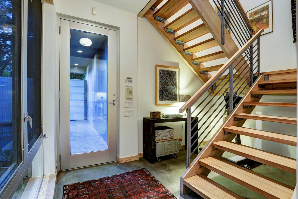 Inspiration for an industrial wooden u-shaped open staircase remodel in Portland