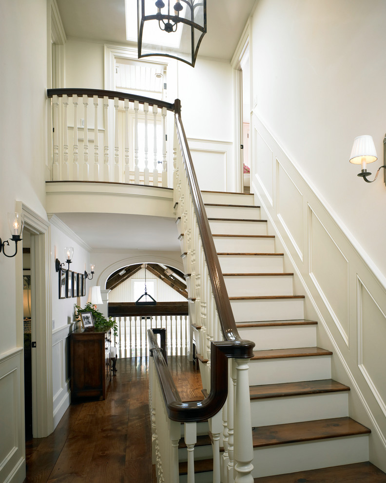 Inspiration for a mid-sized timeless wooden straight staircase remodel in Boston with wooden risers