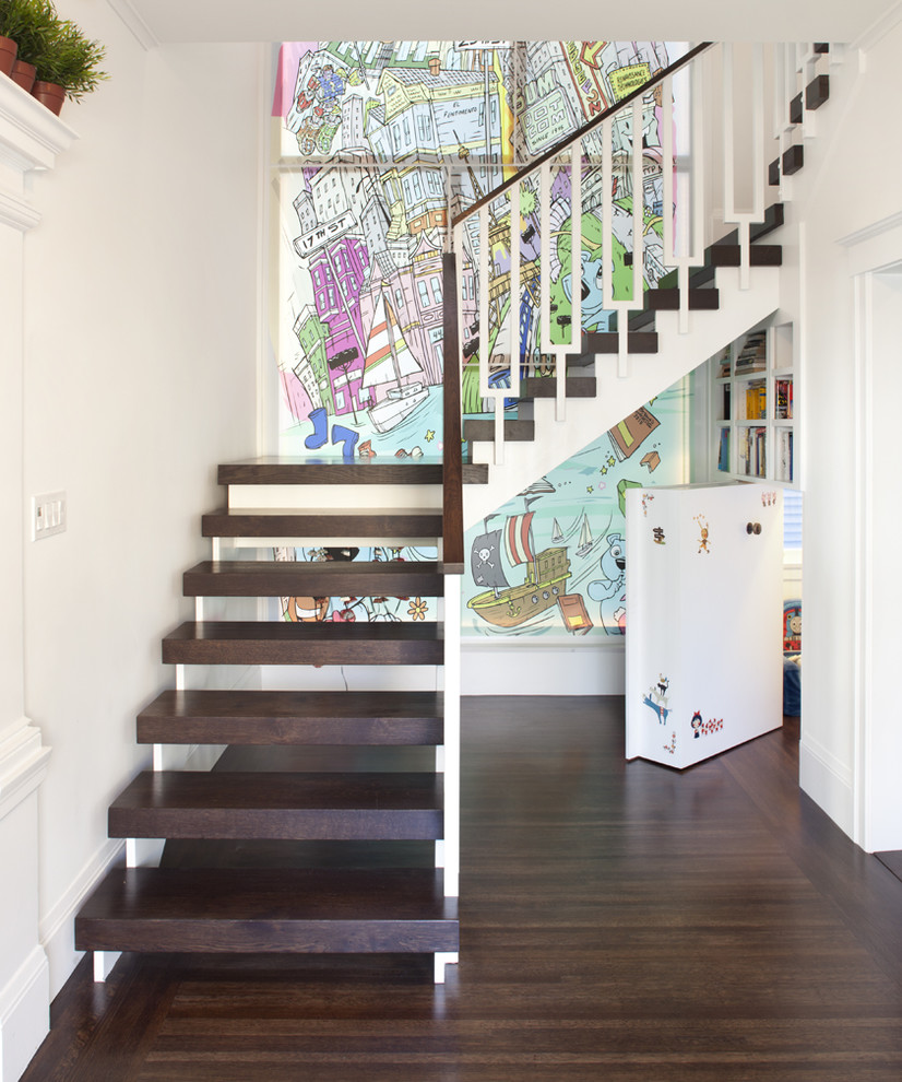 Eclectic wood l-shaped staircase in San Francisco with open risers and under stair storage.