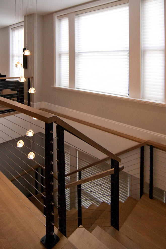 Staircase - large contemporary wooden u-shaped open and cable railing staircase idea in New York
