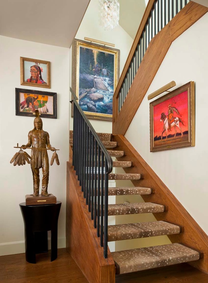 Example of a mid-sized mountain style carpeted u-shaped open staircase design in Denver