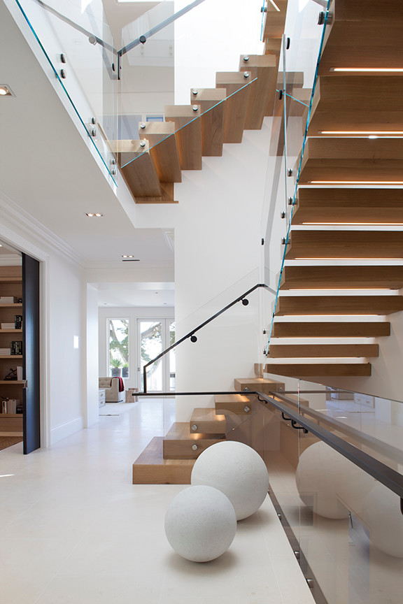 Staircase - modern wooden floating staircase idea in San Francisco with wooden risers