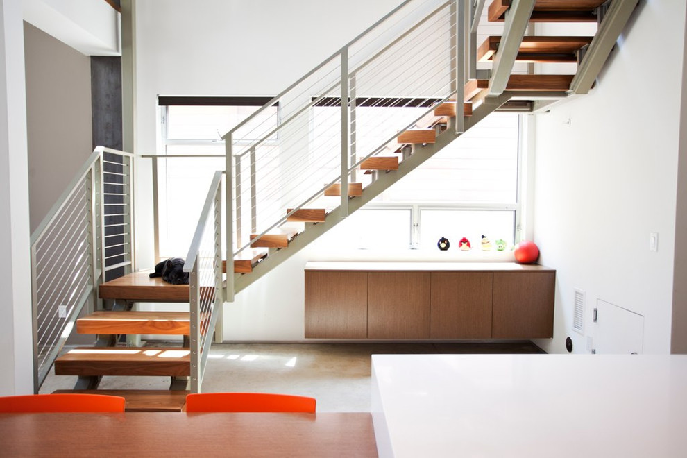 Inspiration for a contemporary wood staircase in Los Angeles with open risers.