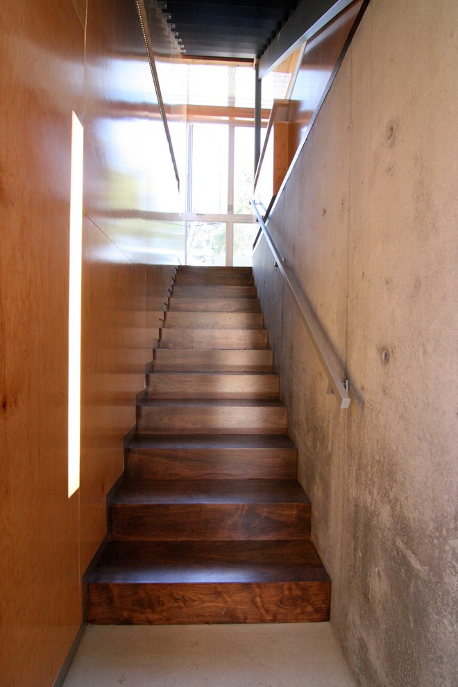 Inspiration for a contemporary wooden straight metal railing staircase remodel in Los Angeles with wooden risers