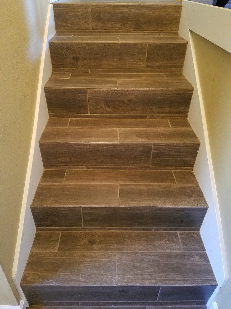 Staircase - small craftsman tile straight staircase idea in San Francisco with tile risers