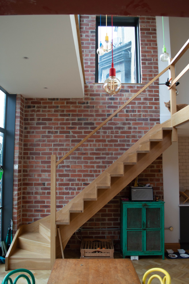 Staircase - large industrial wooden l-shaped wood railing staircase idea in Other with wooden risers