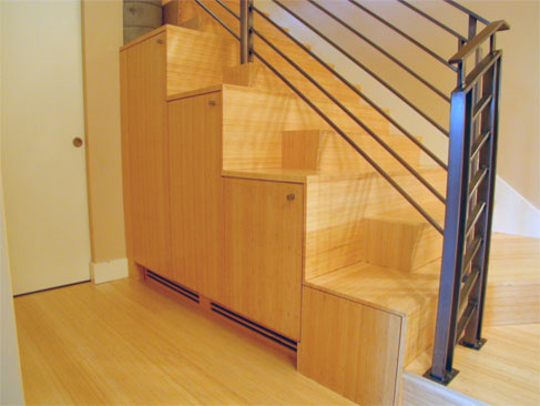 Design ideas for a modern staircase in San Francisco with under stair storage.