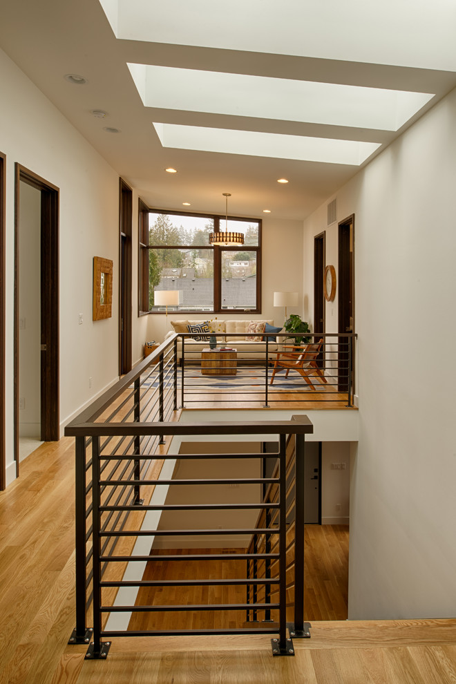 This is an example of a large contemporary wood straight staircase in Seattle.