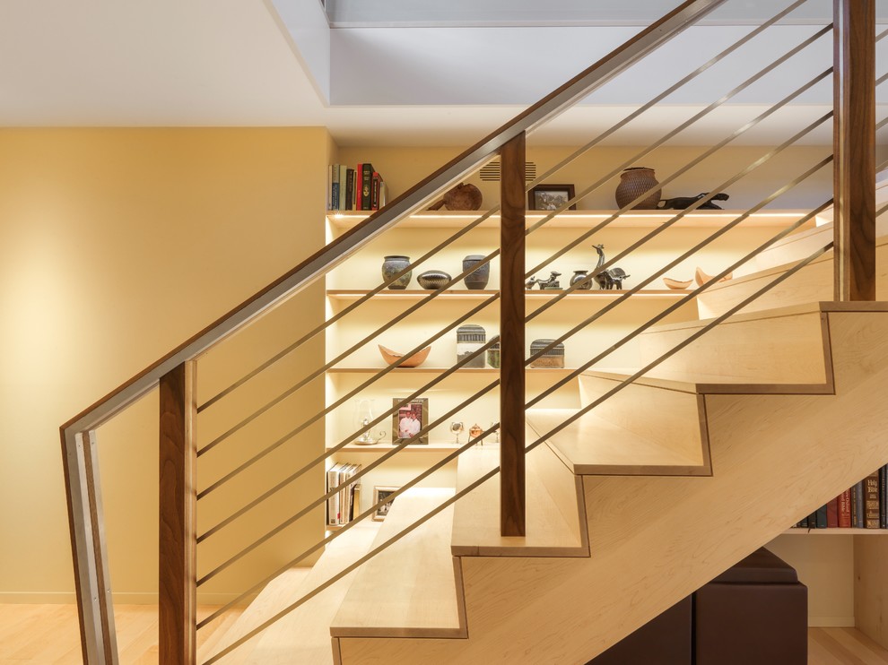 Inspiration for a mid-sized modern wooden straight staircase remodel in Burlington with wooden risers
