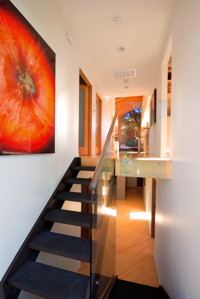 Inspiration for a mid-sized modern concrete l-shaped staircase remodel in San Diego
