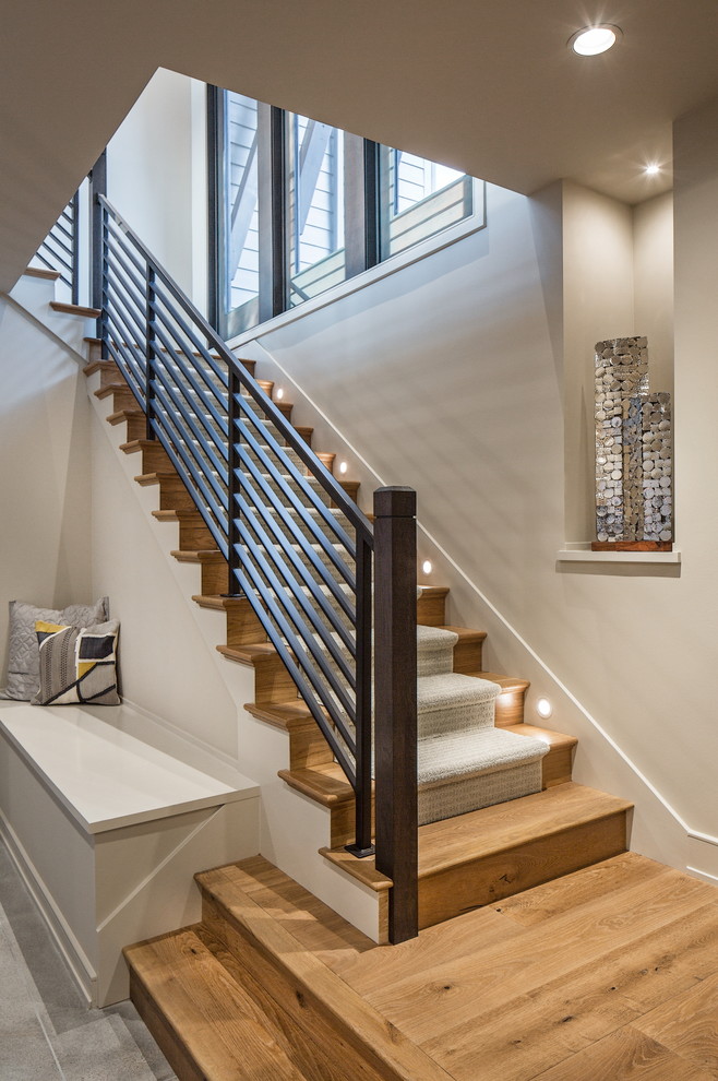 This is an example of a classic staircase in Omaha with feature lighting.