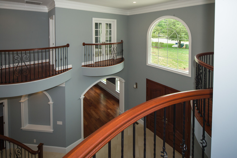 Staircase - huge transitional curved staircase idea in DC Metro