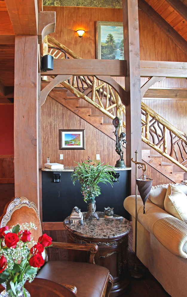 Inspiration for a large rustic wooden straight staircase remodel in Charlotte with wooden risers