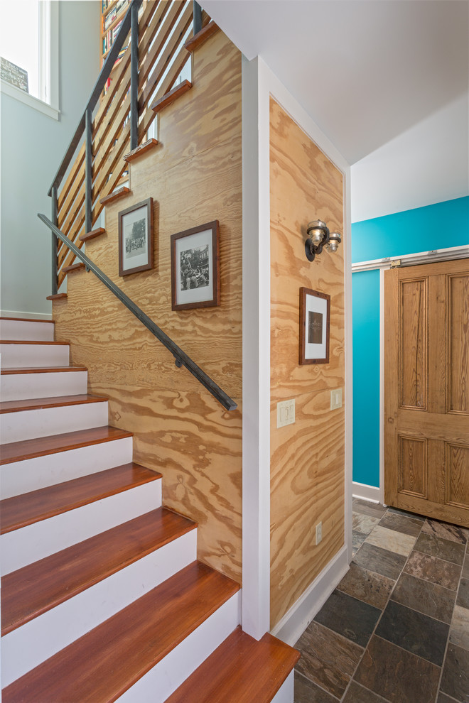 Example of an eclectic wooden u-shaped staircase design in New Orleans with painted risers