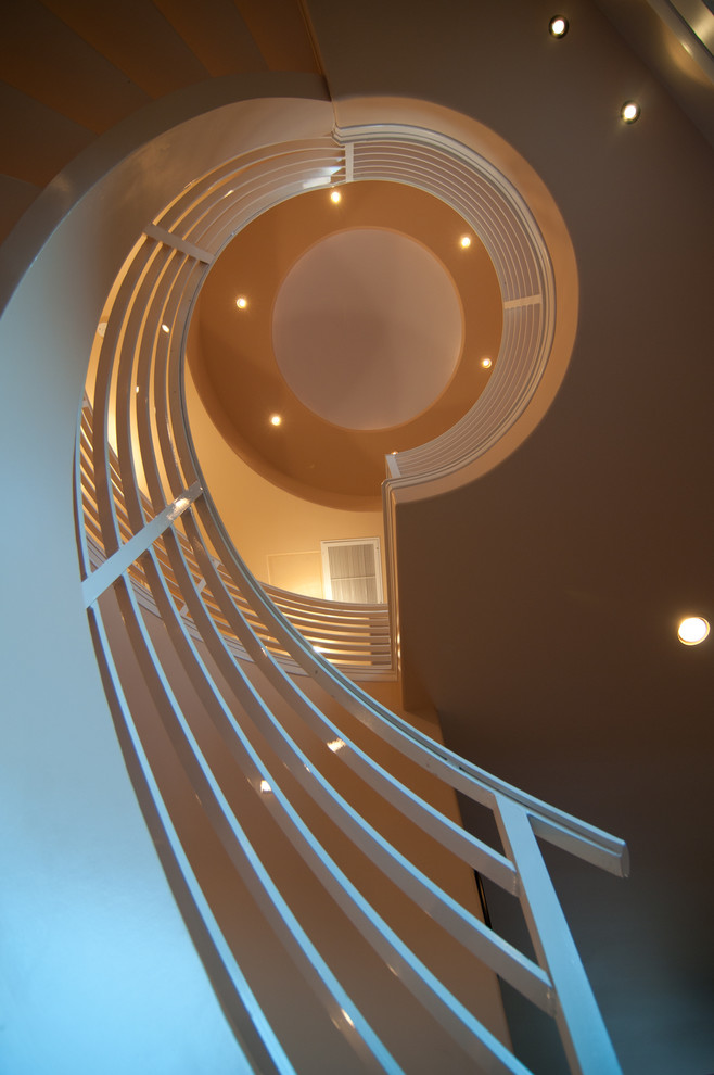 Inspiration for a mid-sized mediterranean metal curved metal railing and open staircase remodel in Hawaii