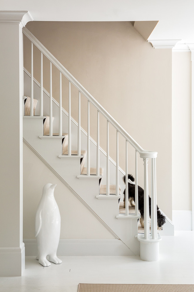 Design ideas for a classic painted wood staircase in Portland Maine with painted wood risers.