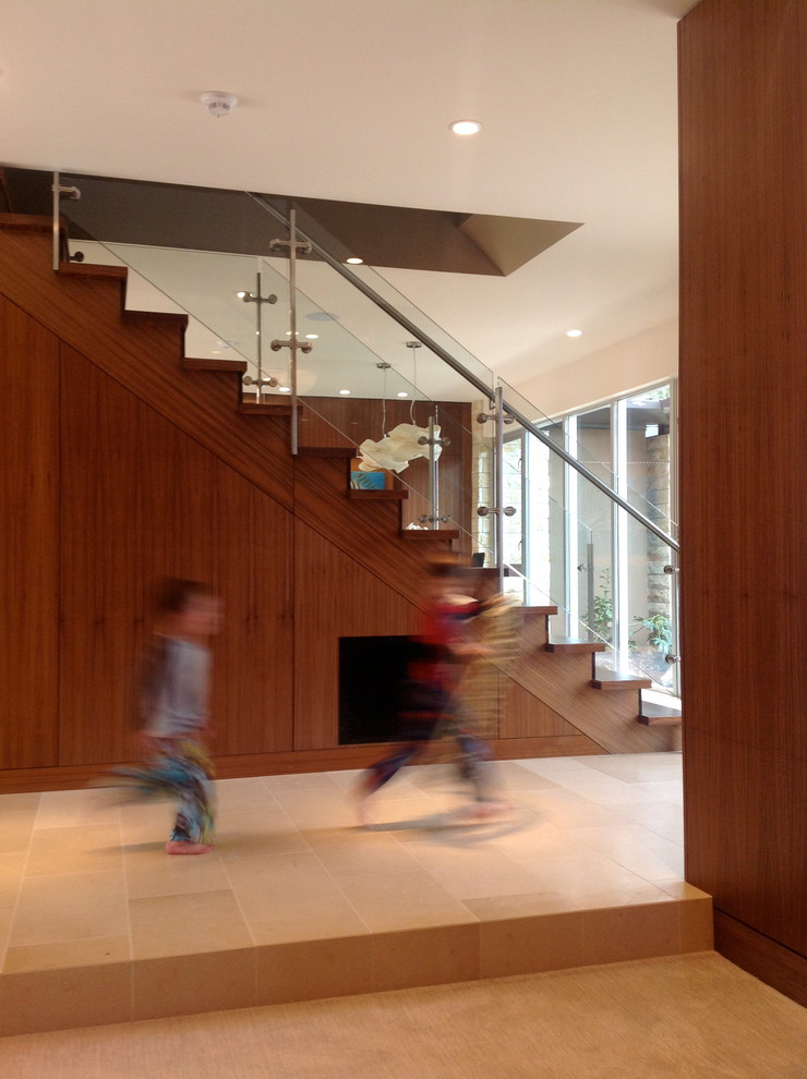 This is an example of a contemporary wood straight staircase in San Francisco with wood risers.