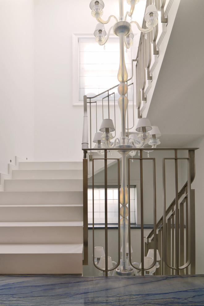 Inspiration for a large contemporary metal floating staircase in London with metal risers.