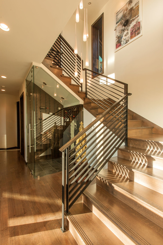 Medium sized traditional wood l-shaped metal railing staircase in Salt Lake City with wood risers.