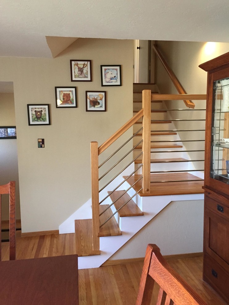 Small contemporary wood l-shaped staircase in San Francisco with wood risers.