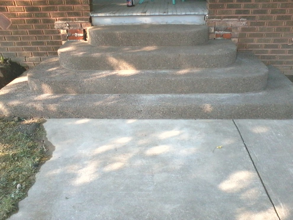 Идея дизайна: изогнутая бетонная лестница среднего размера в современном стиле с бетонными ступенями