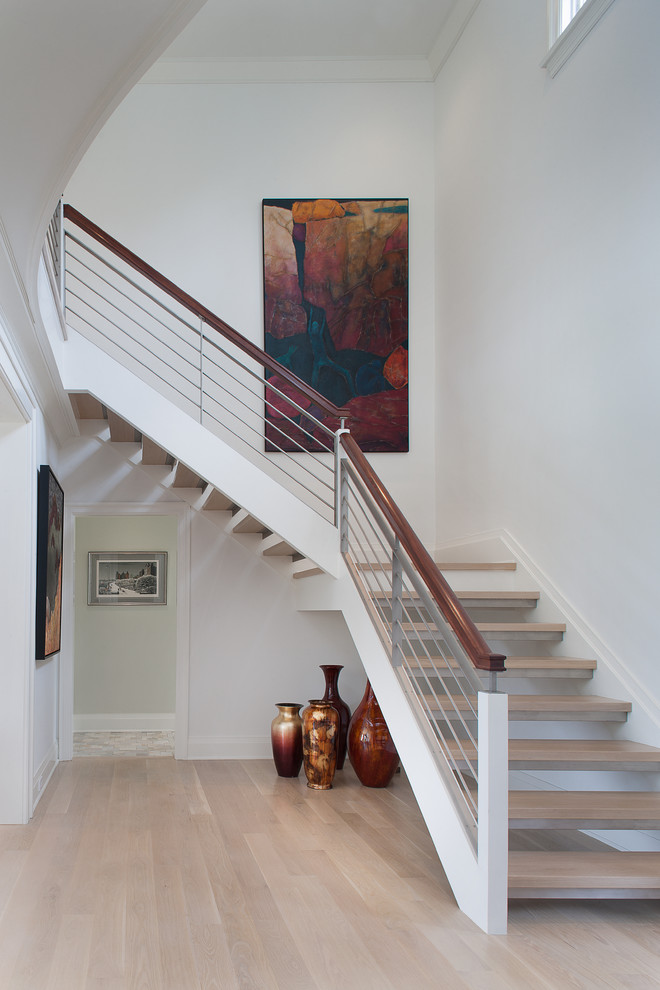 Design ideas for a large contemporary wood l-shaped staircase in New York with open risers.
