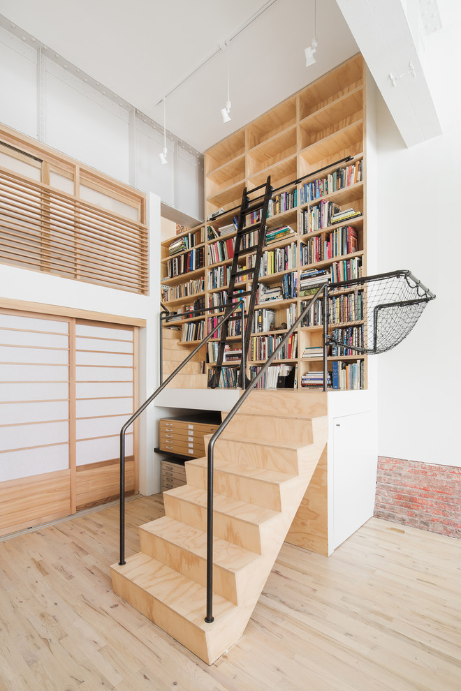 Inspiration for a mid-sized industrial wooden l-shaped metal railing staircase remodel in New York with wooden risers