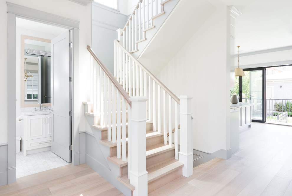 Inspiration for a small classic wood u-shaped wood railing staircase in Vancouver with wood risers.