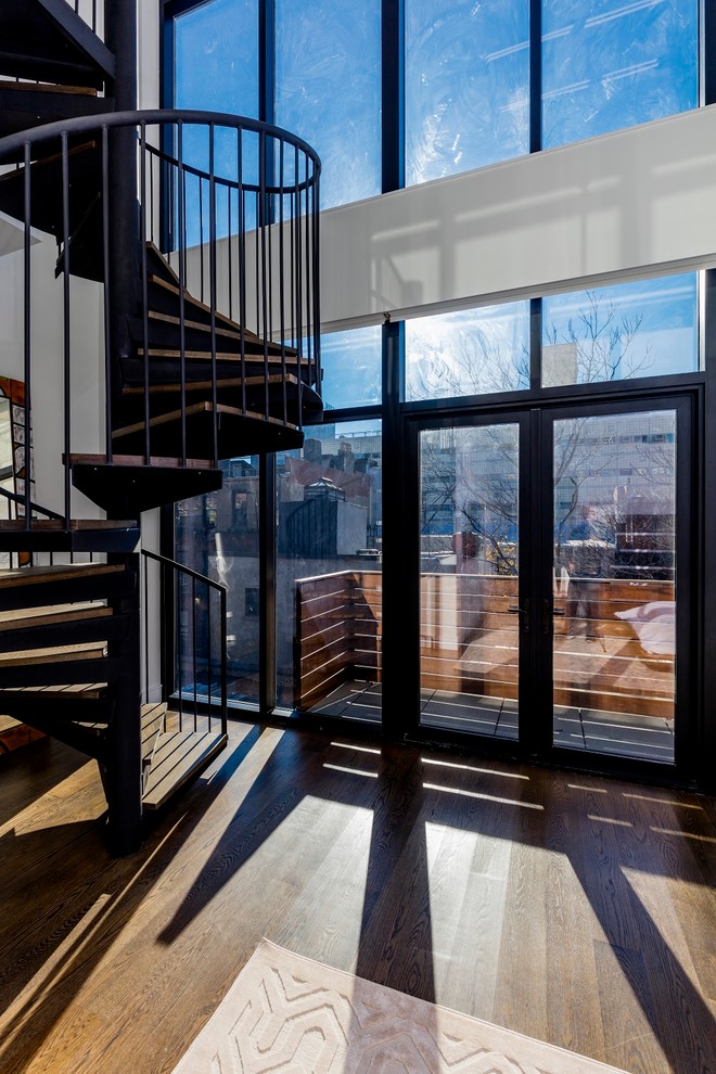 Inspiration for an industrial spiral staircase remodel in New York