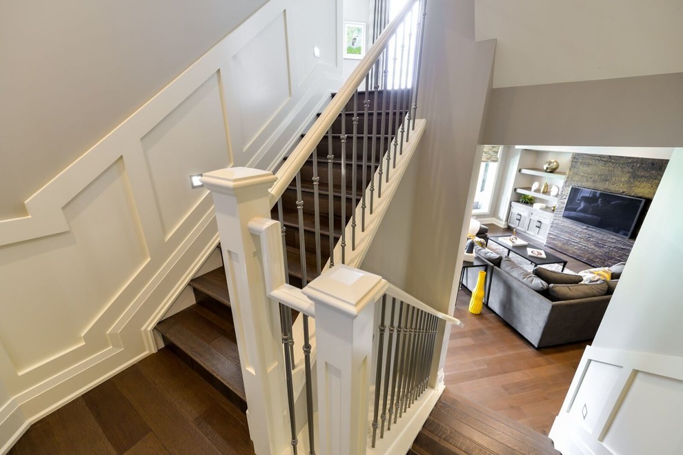 Example of a mid-sized transitional wooden l-shaped wood railing staircase design in Calgary with wooden risers