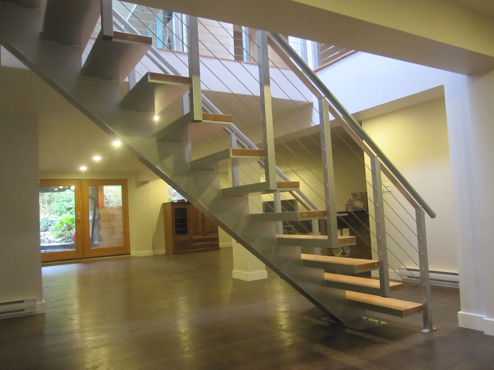 Inspiration pour un escalier sans contremarche flottant design de taille moyenne avec des marches en bois.