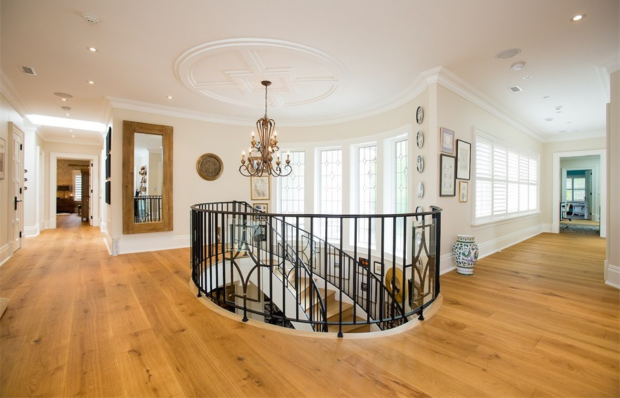 Inspiration for a mid-sized coastal wooden curved staircase remodel in Newark with wooden risers