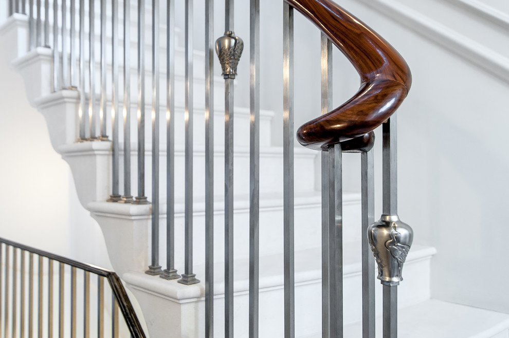 Photo of an expansive traditional curved staircase in London.