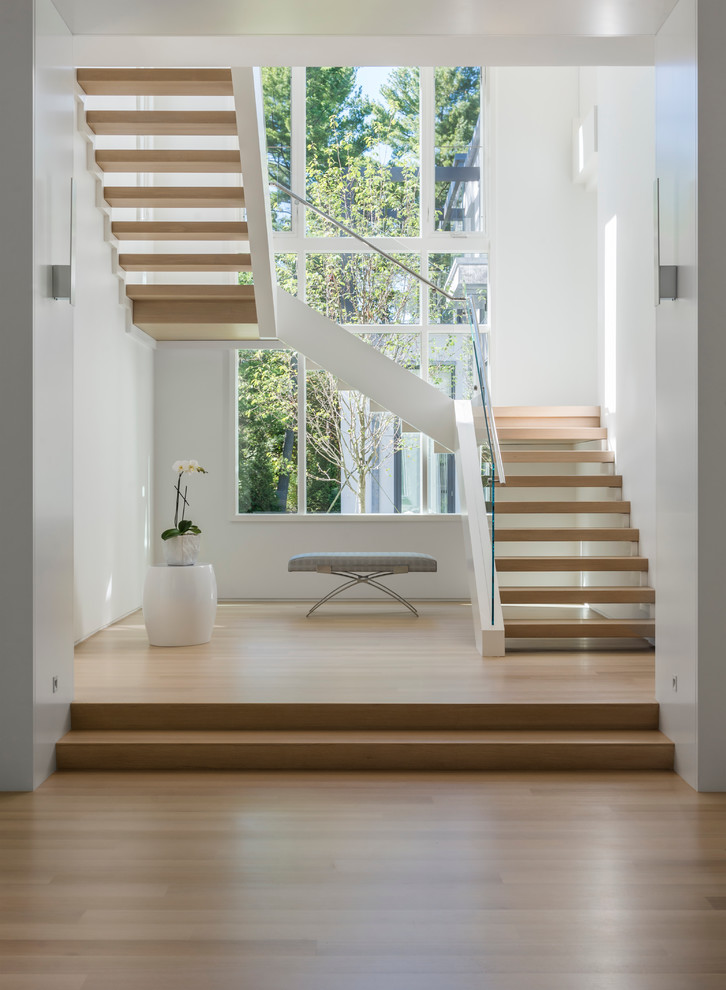 Inspiration for a large modern wooden u-shaped open staircase remodel in Boston